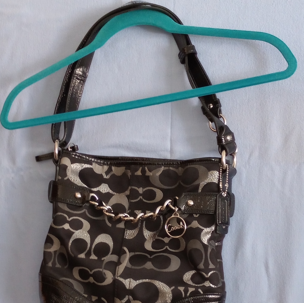 Authentic Coach NWOT black fabric, metallic silver lettering shoulder bag.